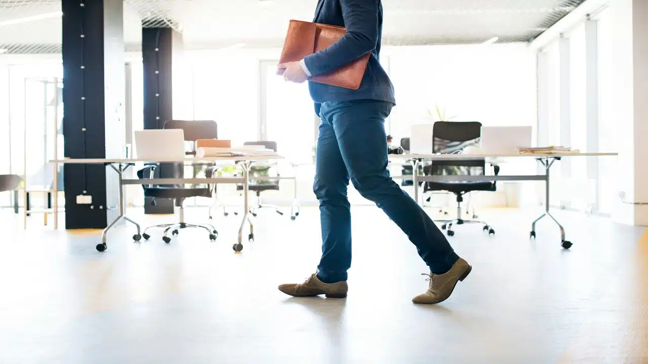 A person walking at an office.