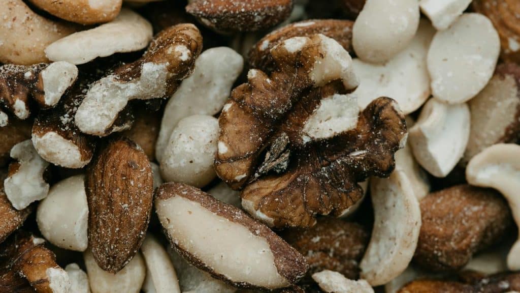 A close-up of assorted salted mixed nuts.