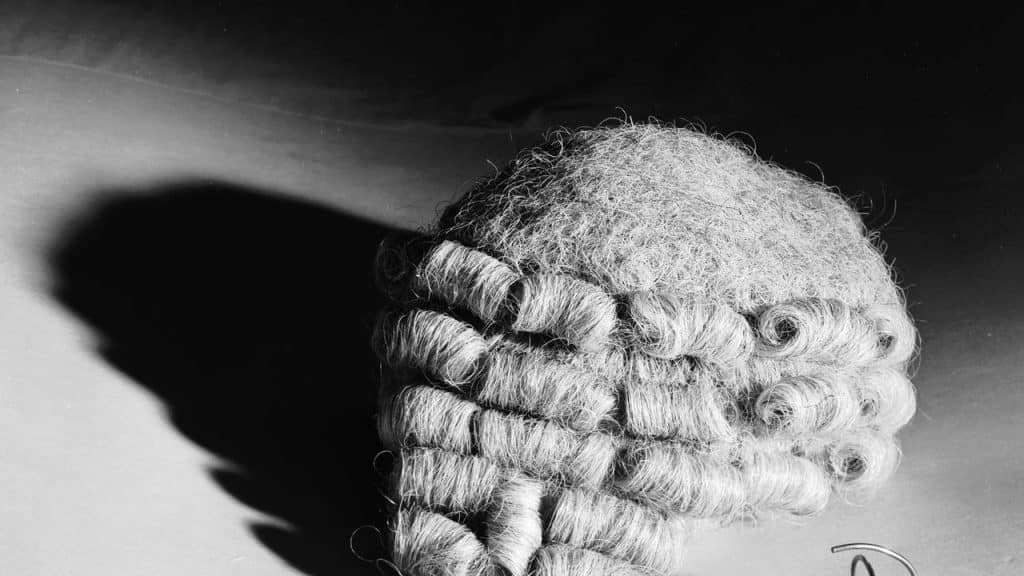 A traditional judge's wig in black and white.