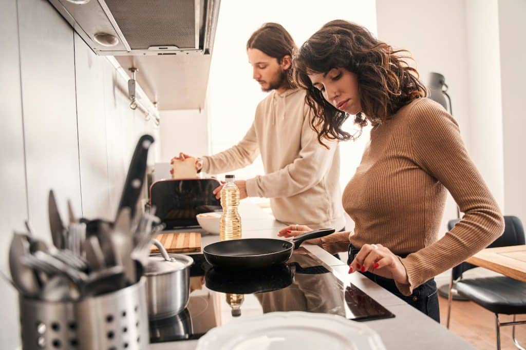 A man and woman at the kitchen