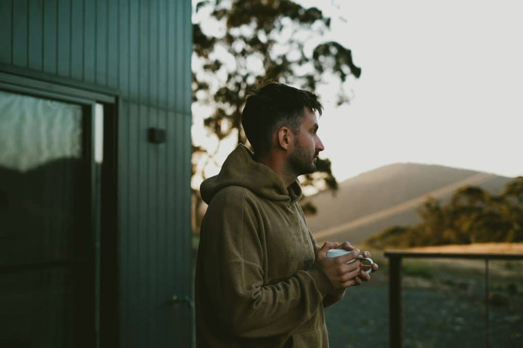 A man holding a cup of coffee