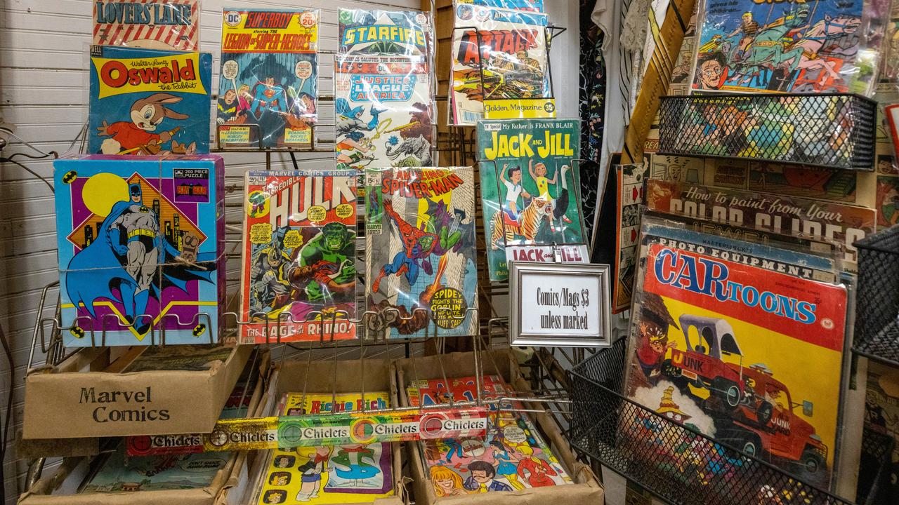 A display of vintage comic books in a shop.