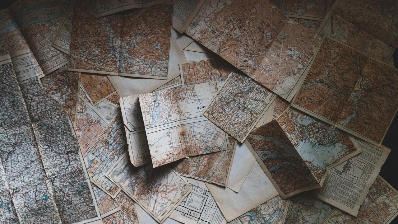 A scattered collection of vintage maps.