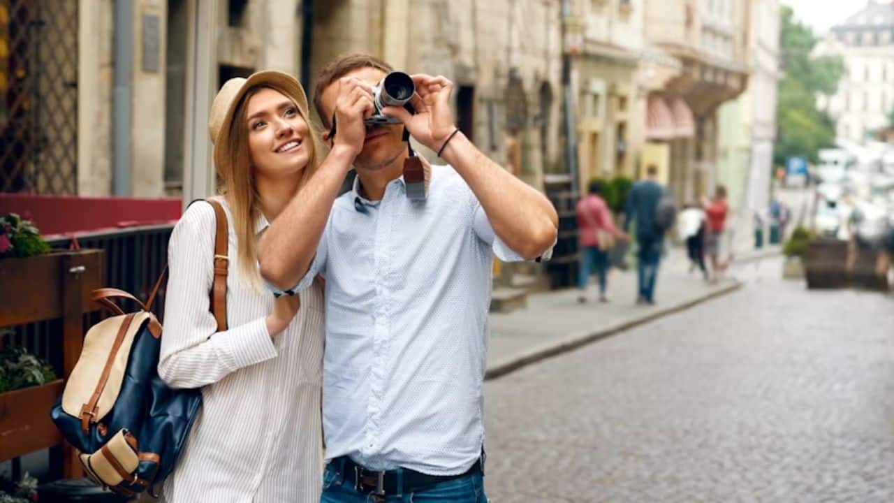 Couple exploring a historic city street together.