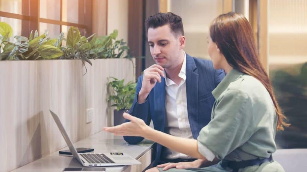 Man listening attentively to woman speaking