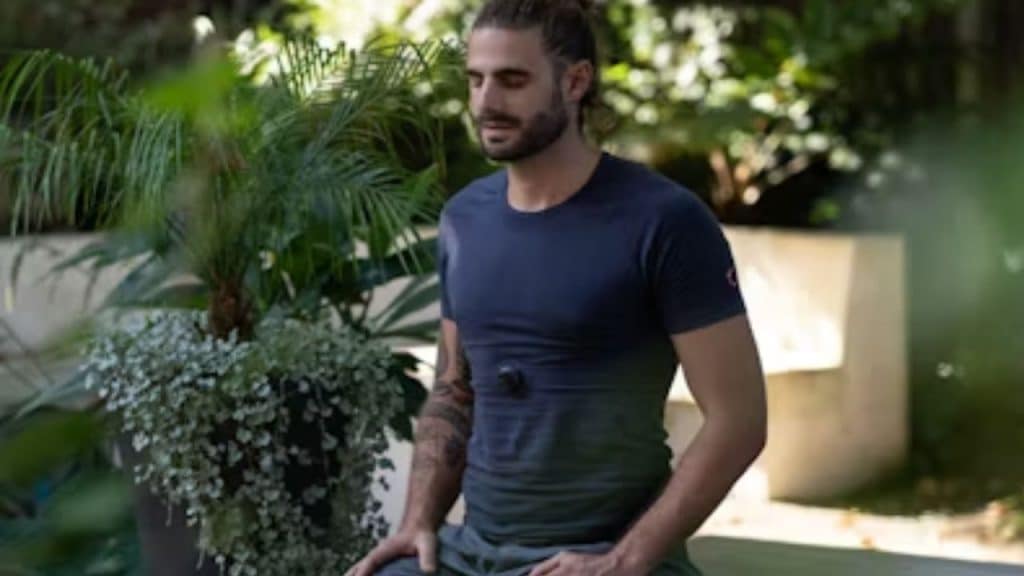 Man meditating outdoors