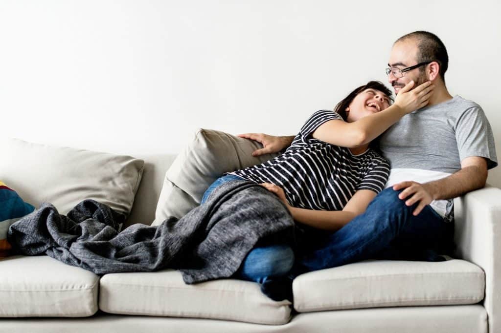 A woman caressing a man's face 