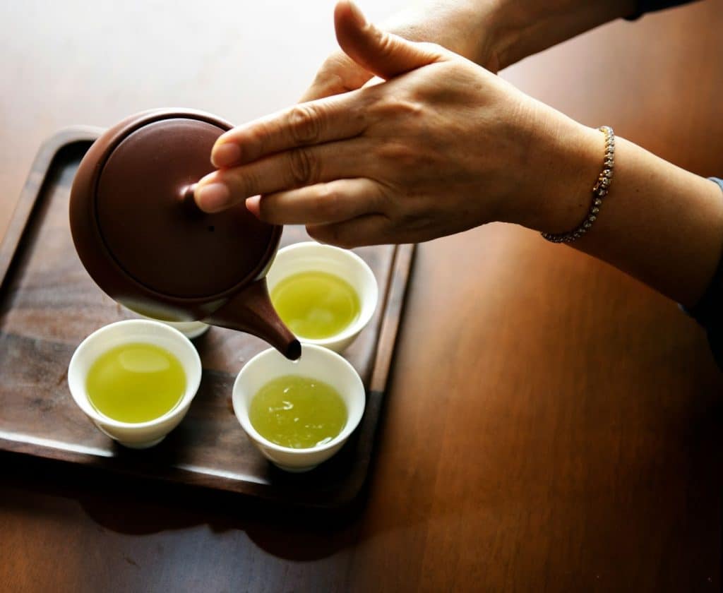 A green tea poured in a teacup
