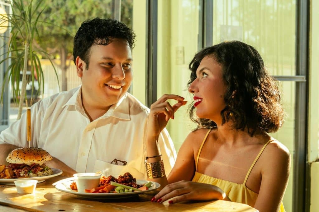A man and woman eating together