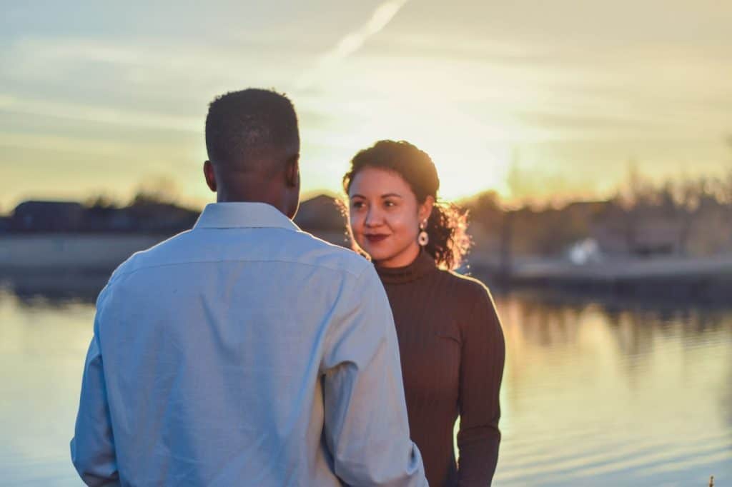 A man and woman facing each other