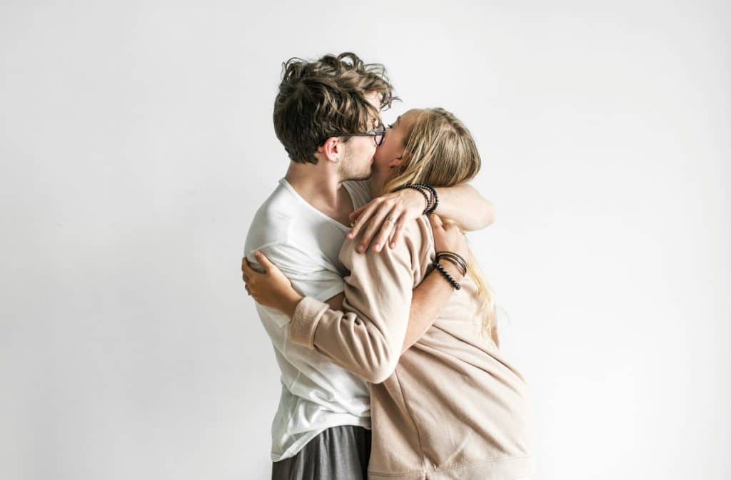 A man kissing a woman’s cheek