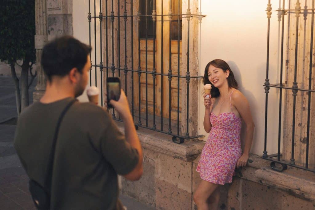 A man taking a picture of a woman