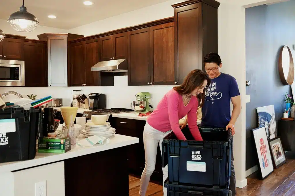 A man and woman helping each other