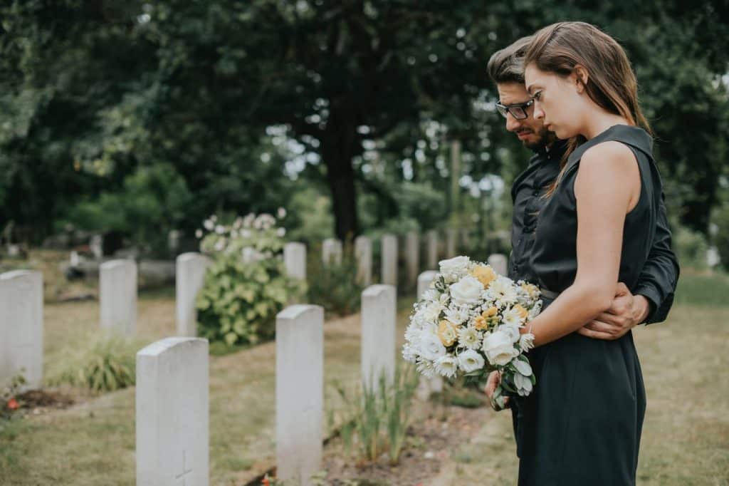 A man comforting a woman