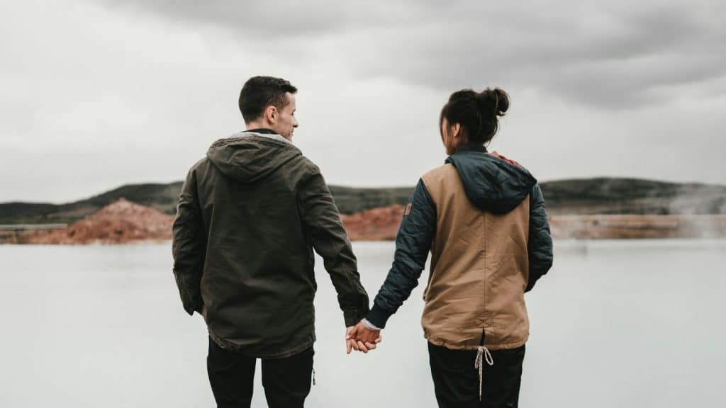 A man and woman holding hands