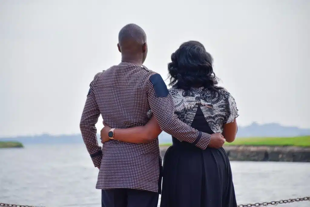 A man and woman holding each other