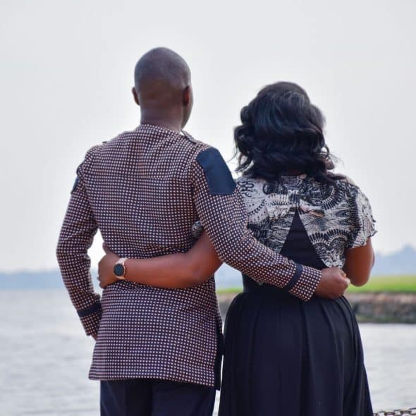 A man and woman holding each other