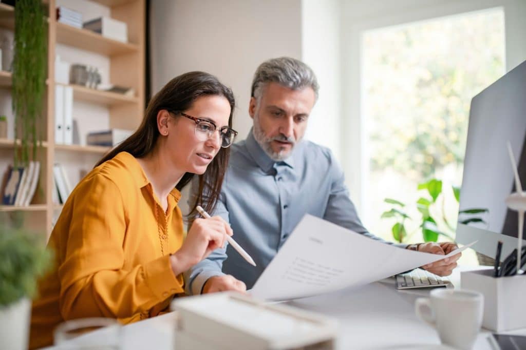 A man and woman tracking financial activities