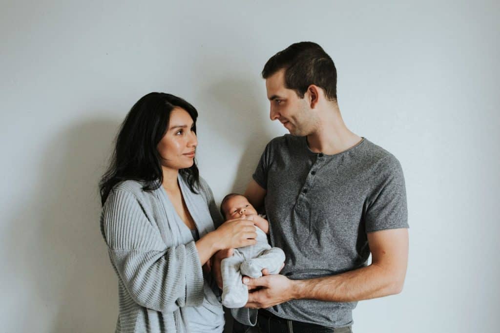 A man and woman with their child