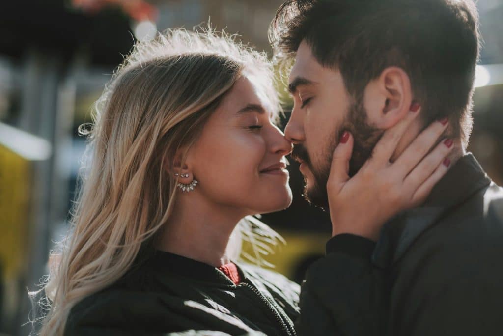 A man and woman facing each other