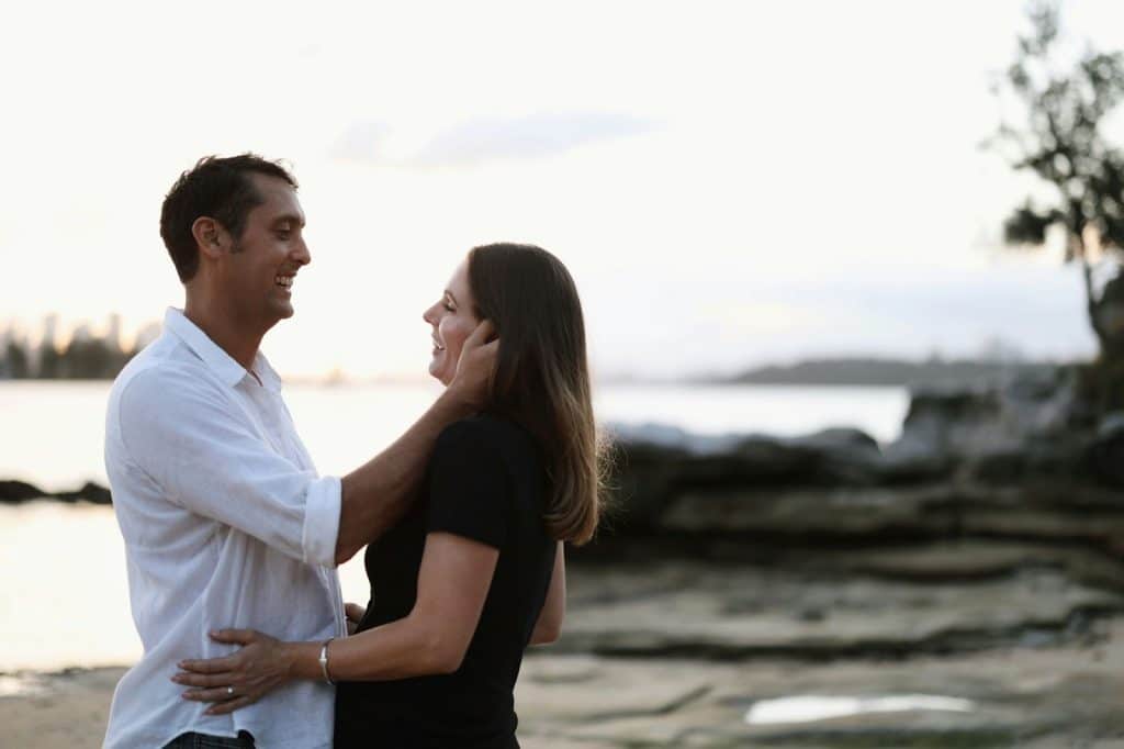 A man and woman facing each other