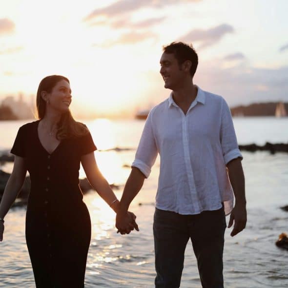 A man and woman holding hands