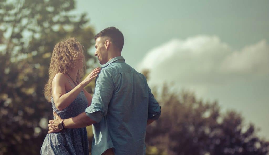 A man and woman looking at each other