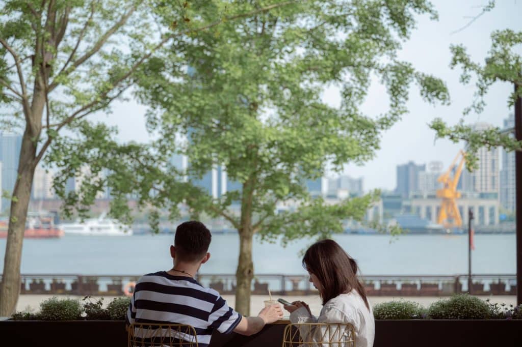 A man and woman having a calm moment at the park