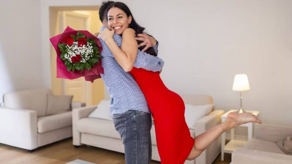 Couple hugging and enjoying time together while celebrating success