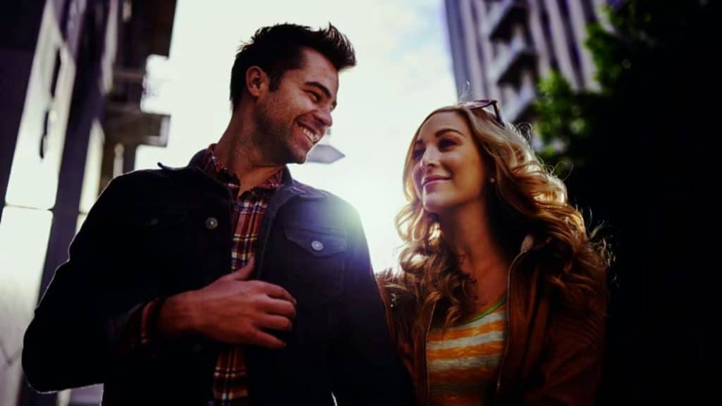 Couple smiling on a slow evening walk