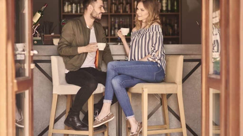 Couple sitting with coffee having open talk