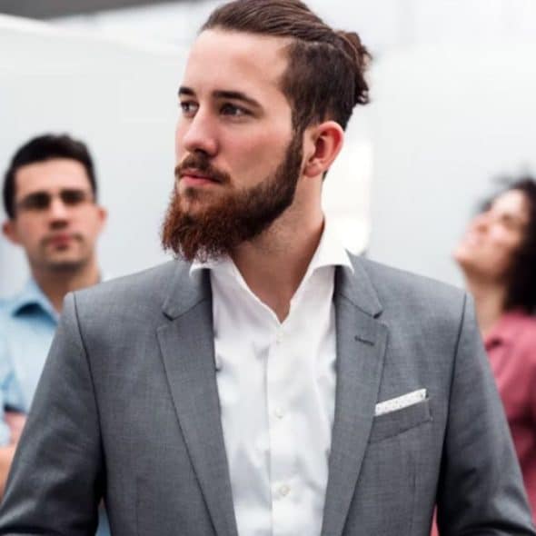 Confident man walking tall in a crowd