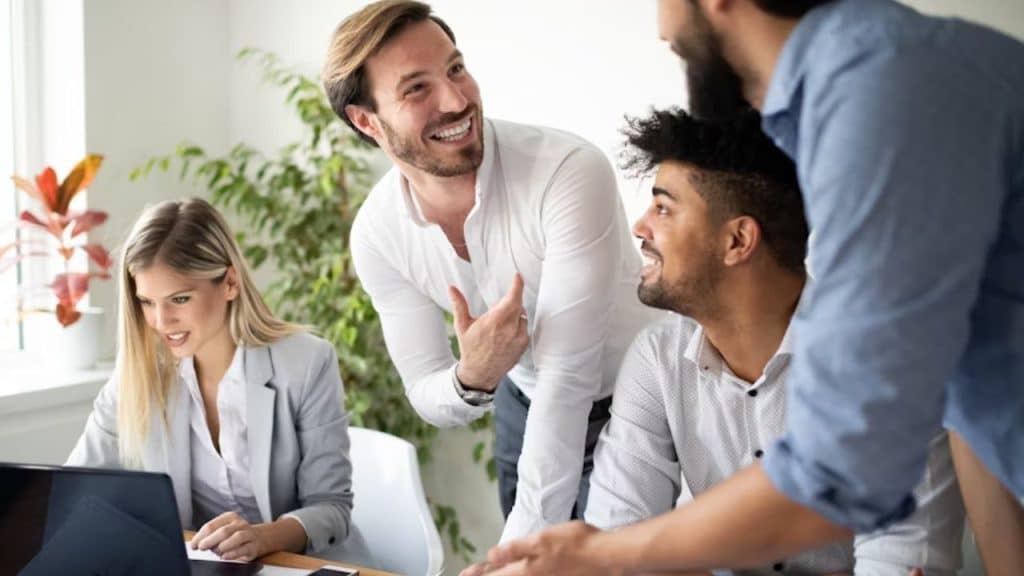 Man guiding a group discussion with ease