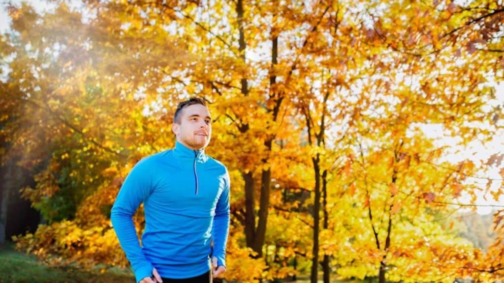 Man walking alone in nature trail for mental reset