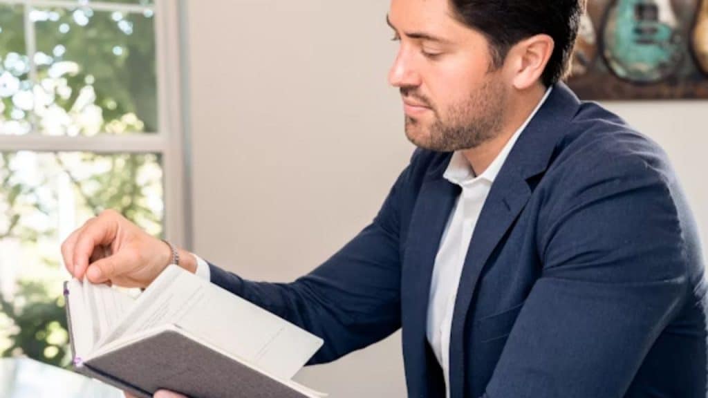 Man reviewing personal budget at home