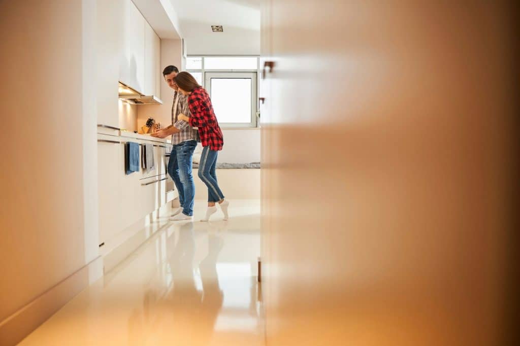A man making a meal for a woman