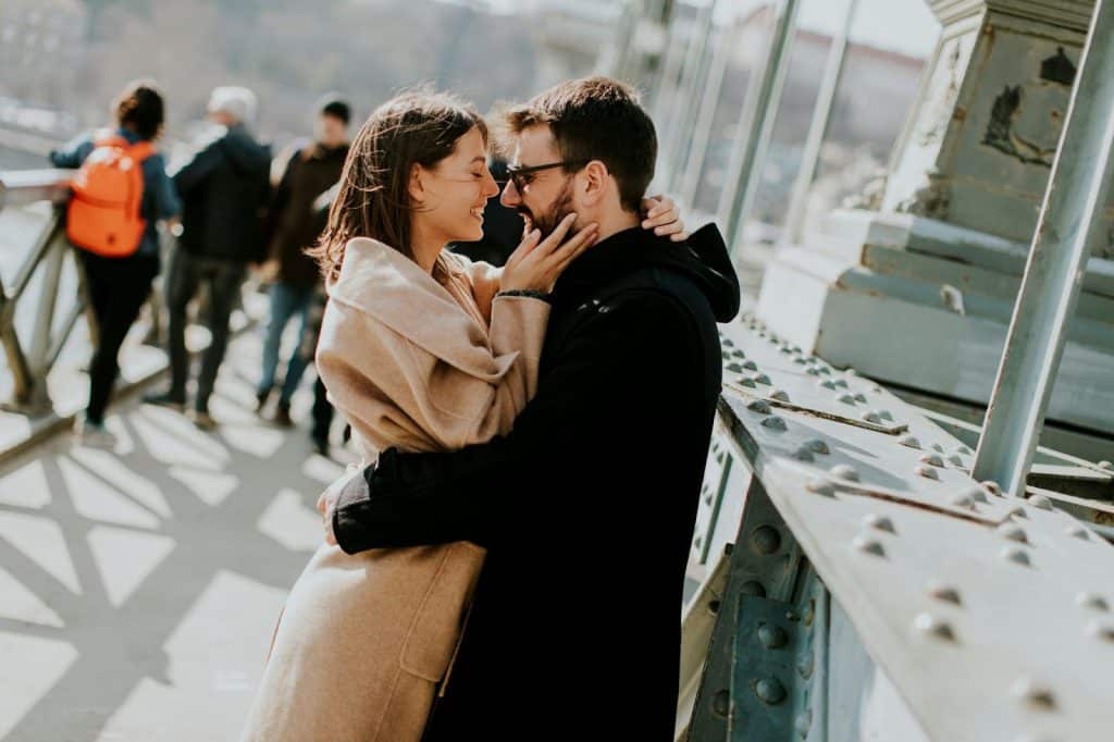 A man and woman facing each other