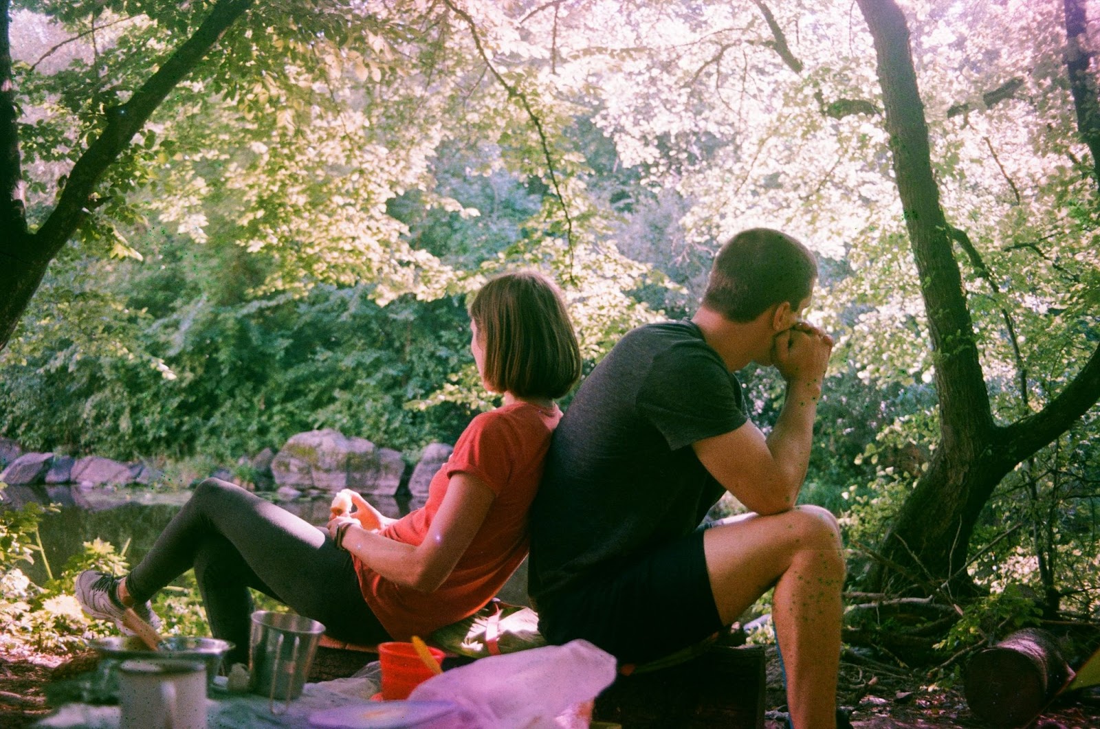 A woman leaning to a man’s back.