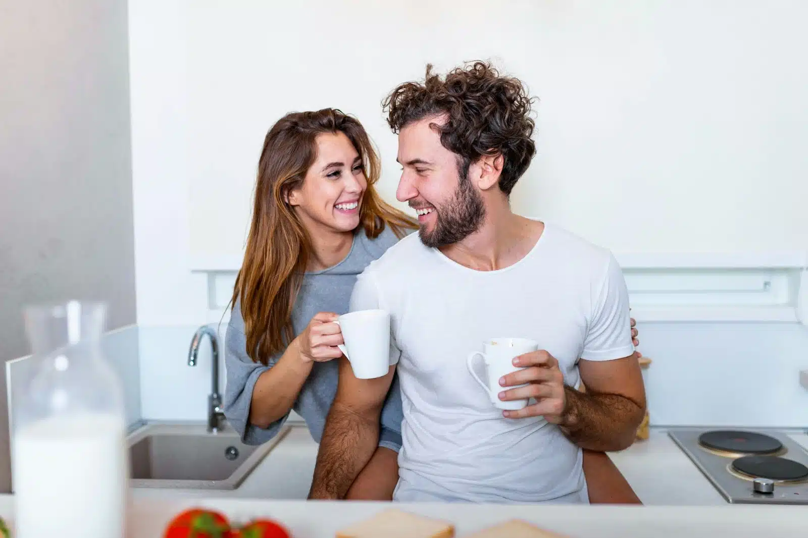 A man and woman having a coffee together.