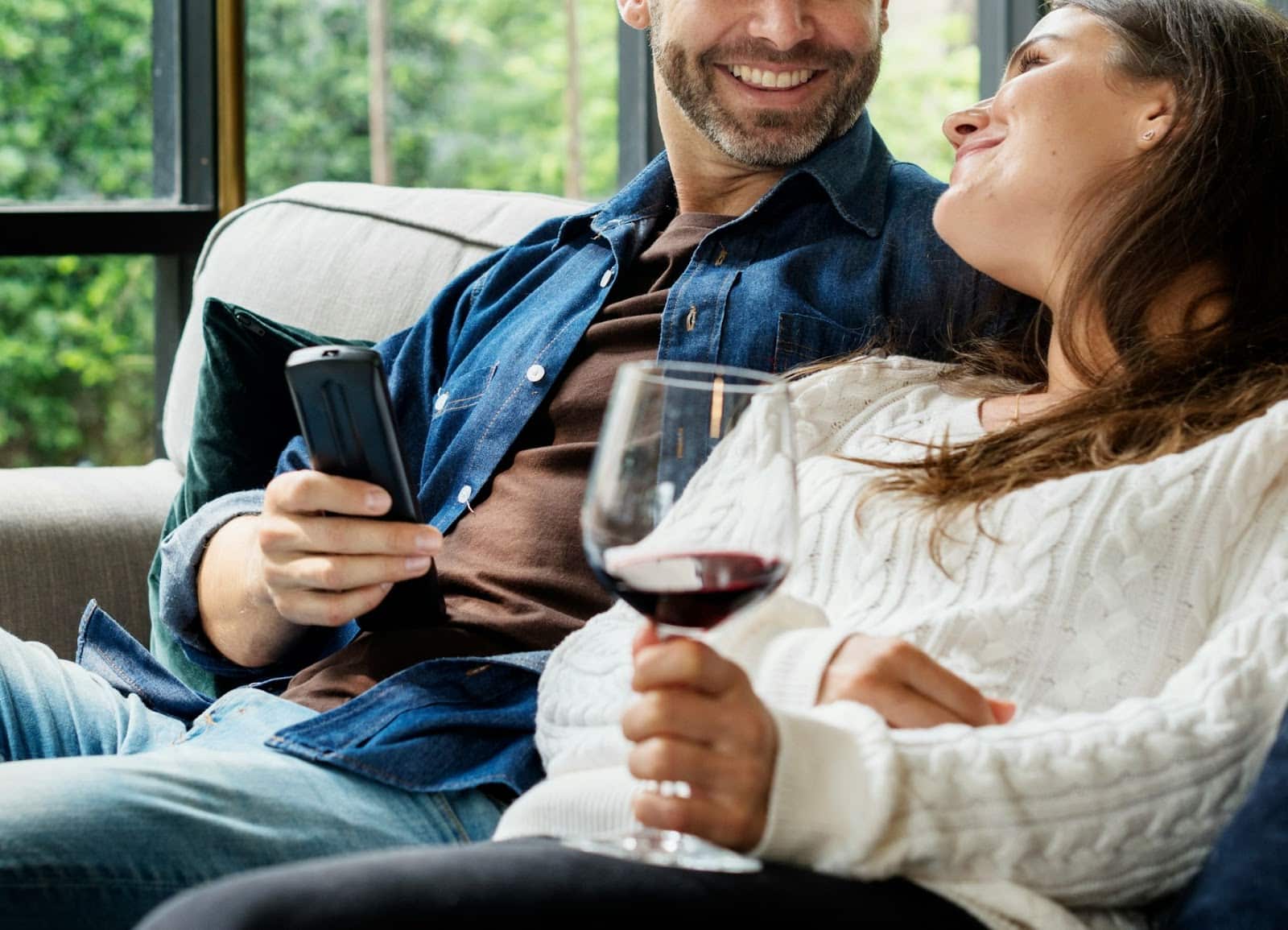 A man and woman chilling at home.