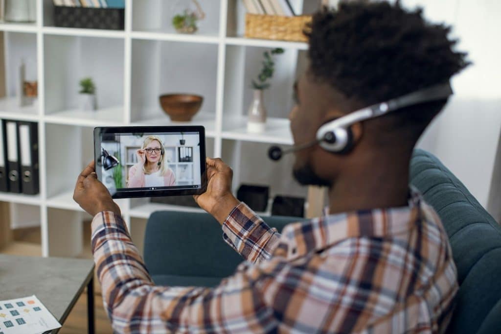 A man and woman talking through online