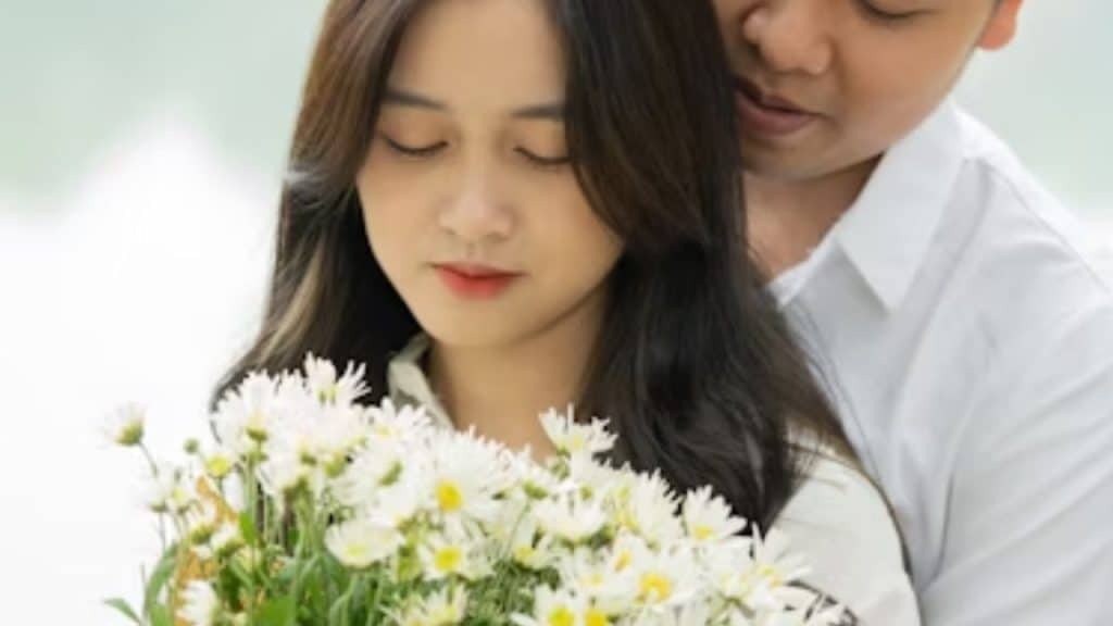 A man giving flowers while a woman appears unimpressed