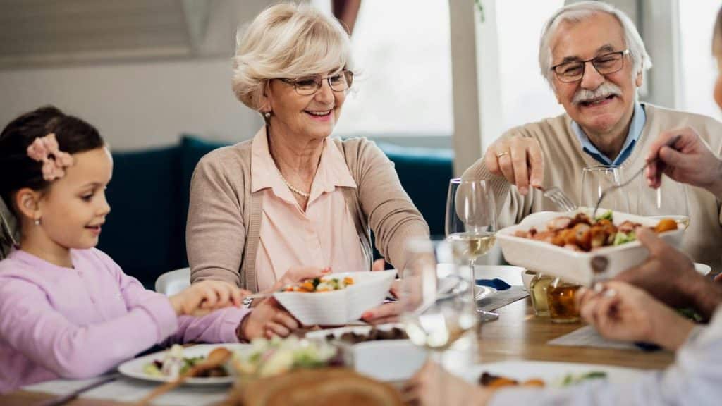 A family enjoys a meal together at the table