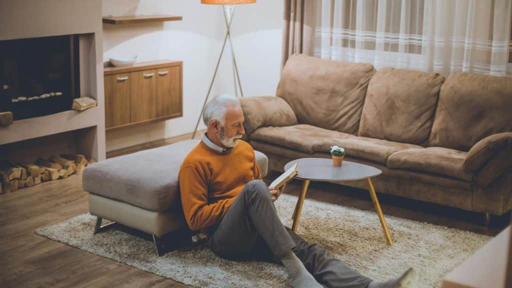 A glass of beer on a table in a restaurant.