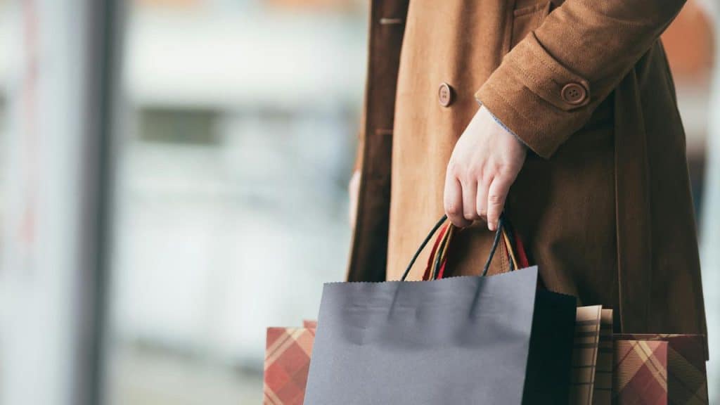 A person holding shopping bags.