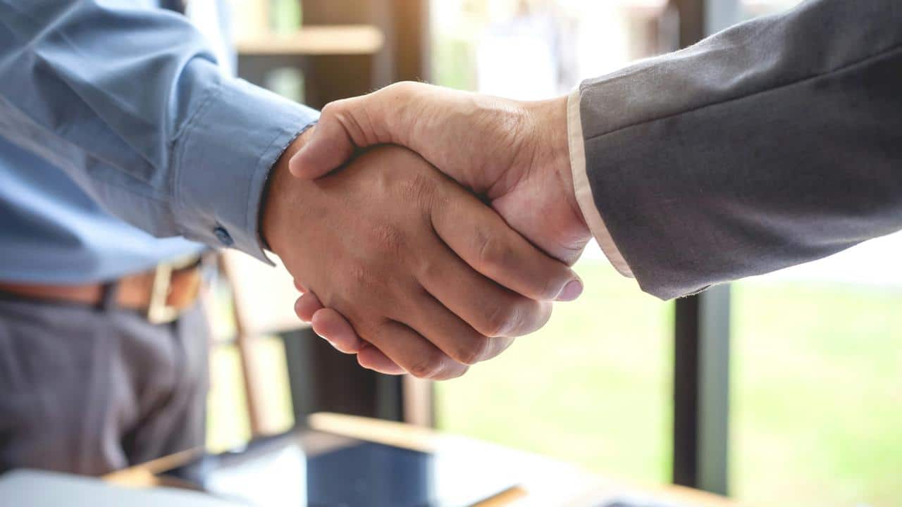 A close-up of a business handshake.