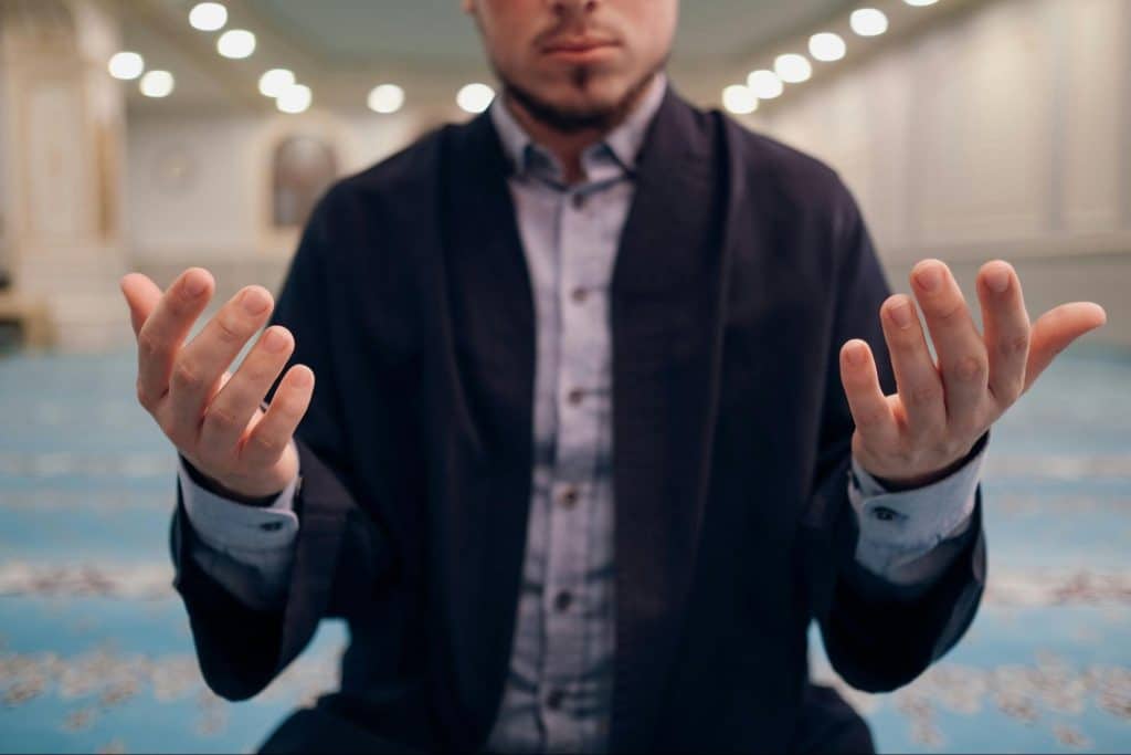 A man just lifting hands as sign of “I am wrong”