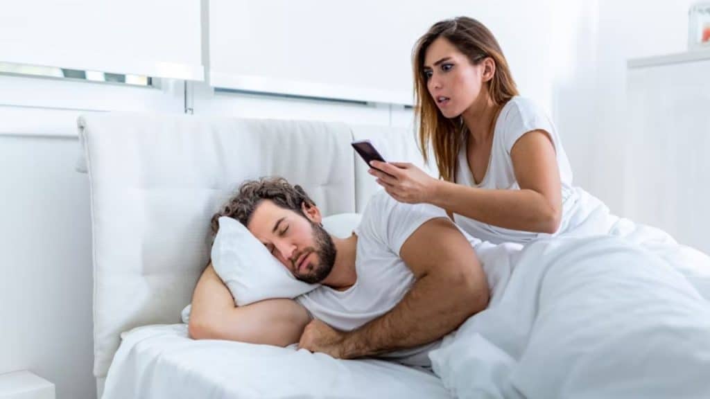 Woman discovering suspicious messages on phone