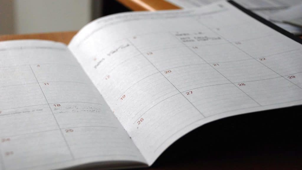 An open planner showing calendar dates.