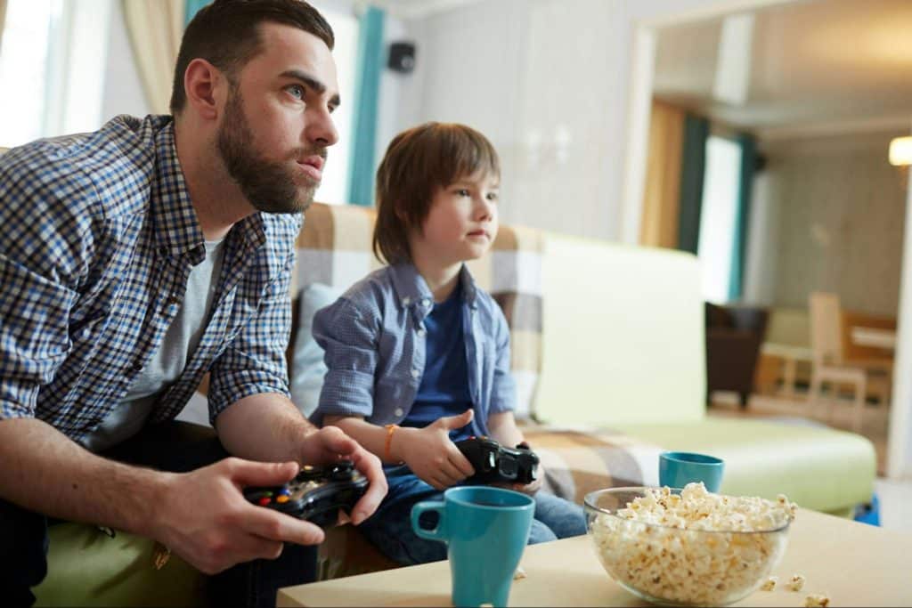 A man playing games with a boy 